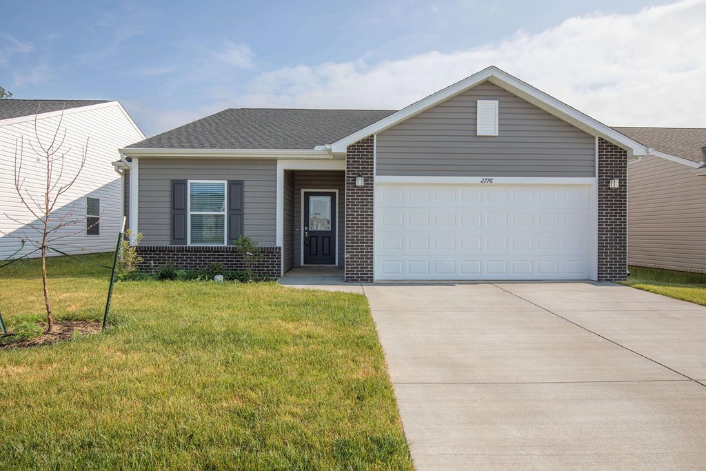 a house with a driveway and a garage door