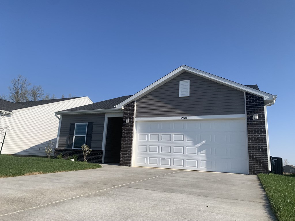 a house with a white garage door in front of it