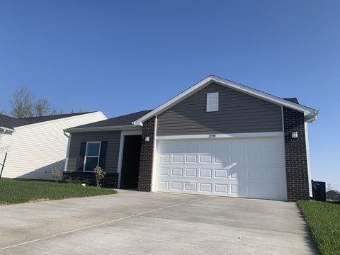 a house with a white garage door in front of it