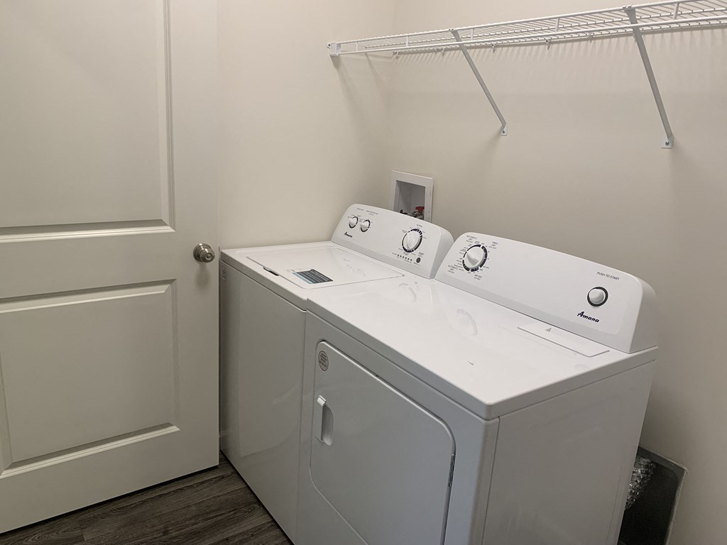 a washer and dryer in a laundry room with a door