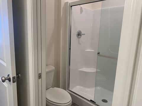 a small bathroom with a shower and a toilet