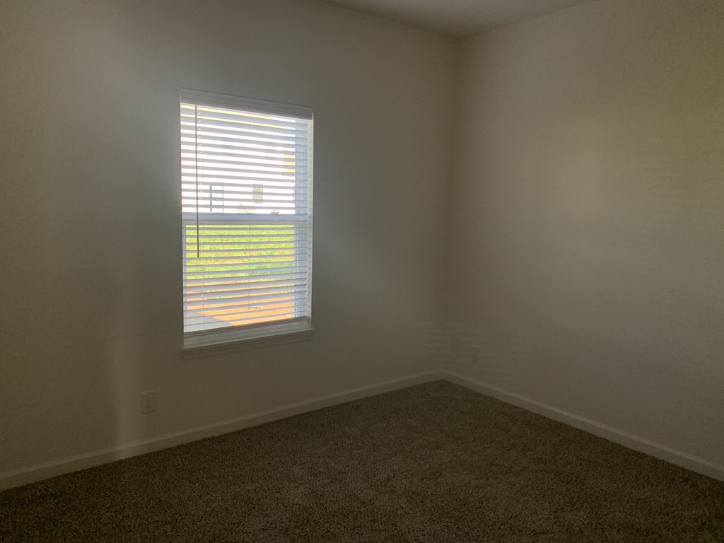 an empty room with a window in it