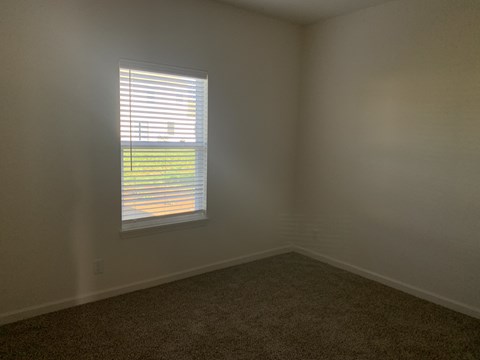 an empty room with a window in it