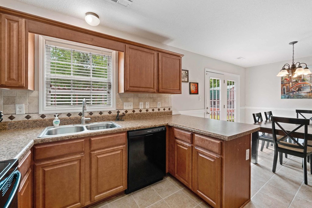 a kitchen with a sink and a counter top