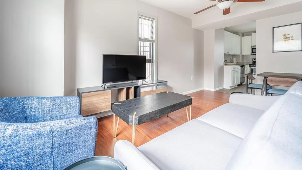 a living room with a couch and a tv