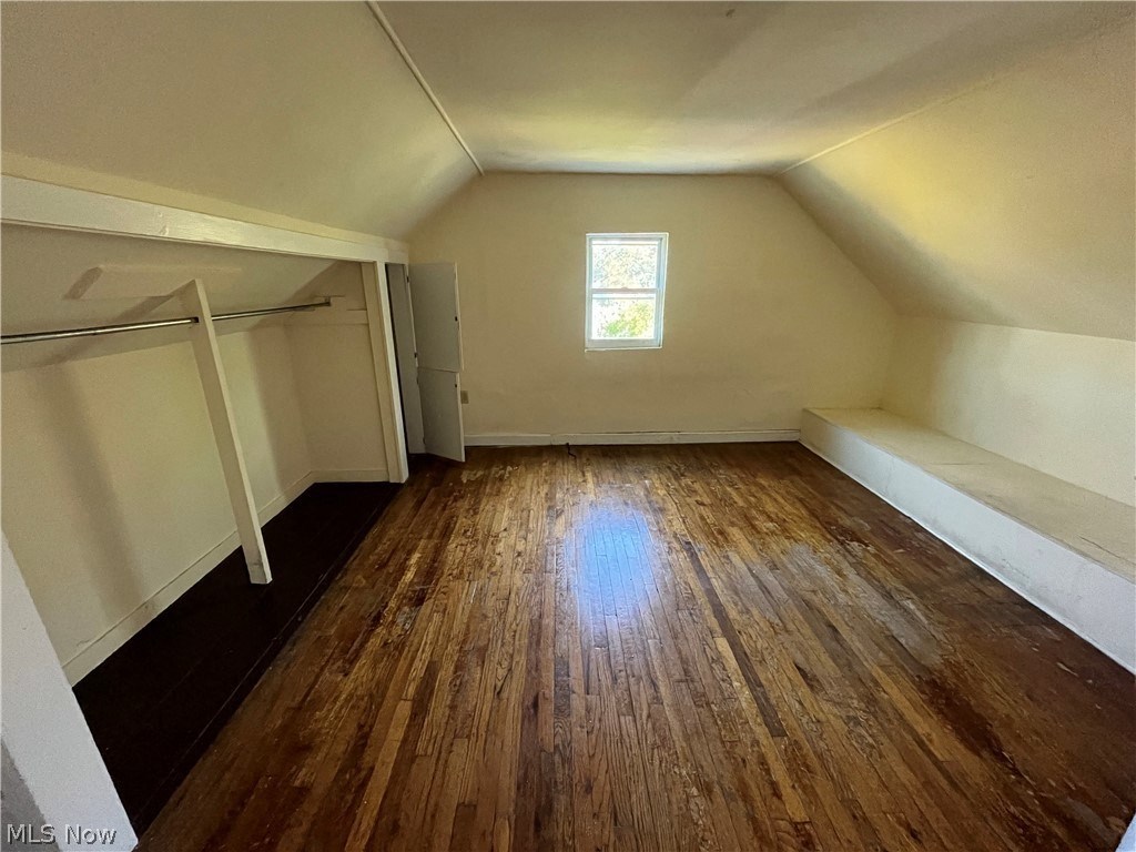 a room with a hard wood floor and a window
