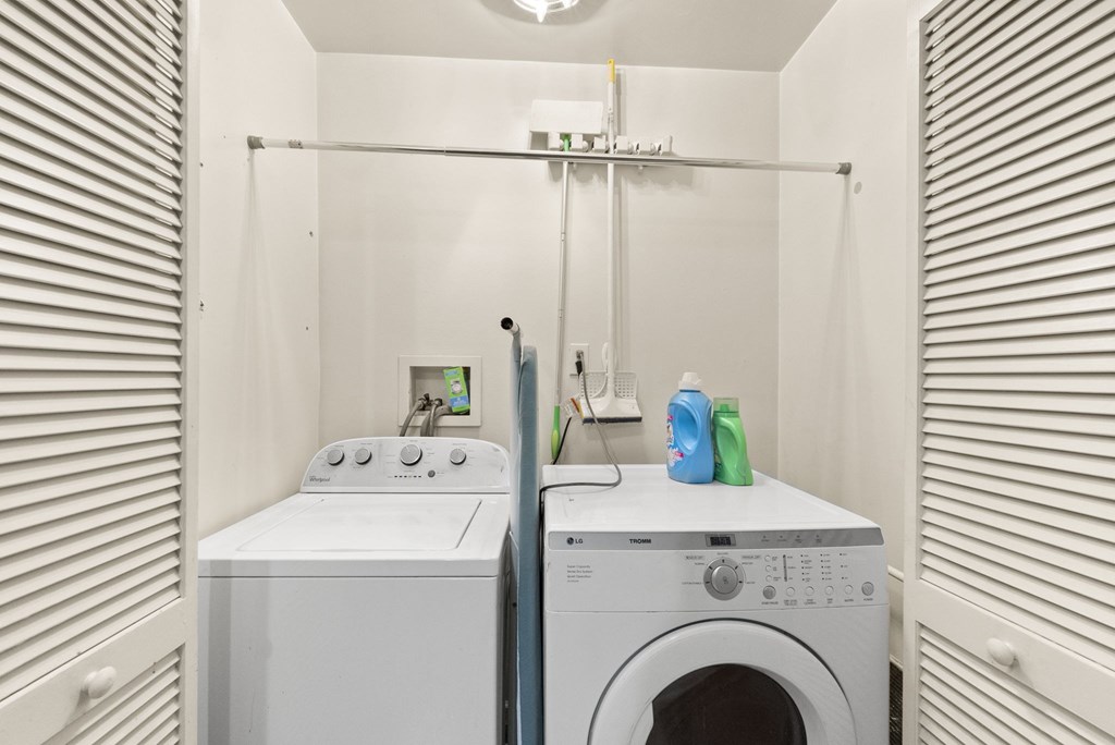 a laundry room with a washer and a washing machine