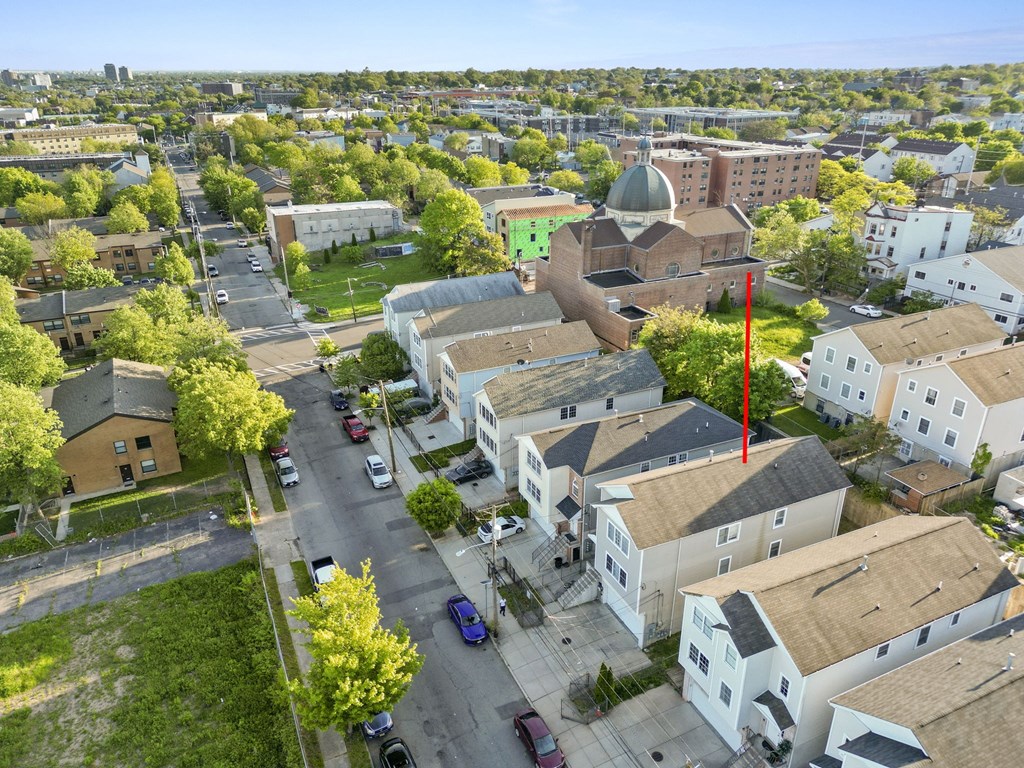 an aerial view of a neighborhood with houses and a mosque