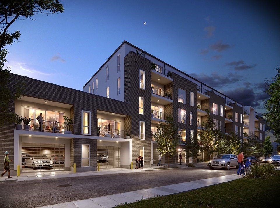 a rendering of an apartment building at night