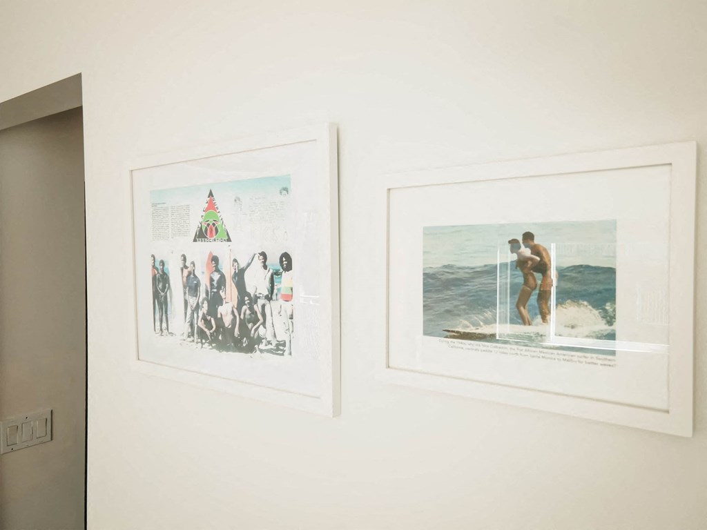 a couple of pictures hanging on a wall in a room