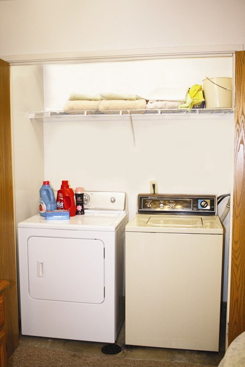 a small laundry room with a washer and a dryer
