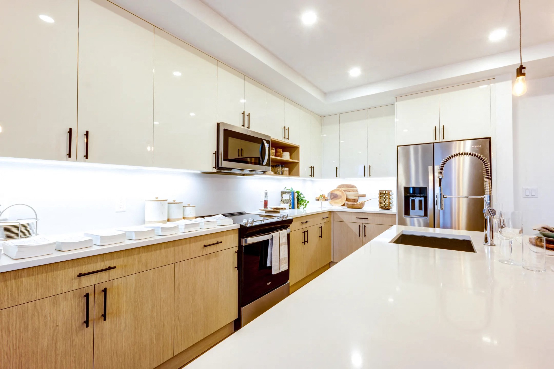 a large kitchen with a counter top and a sink