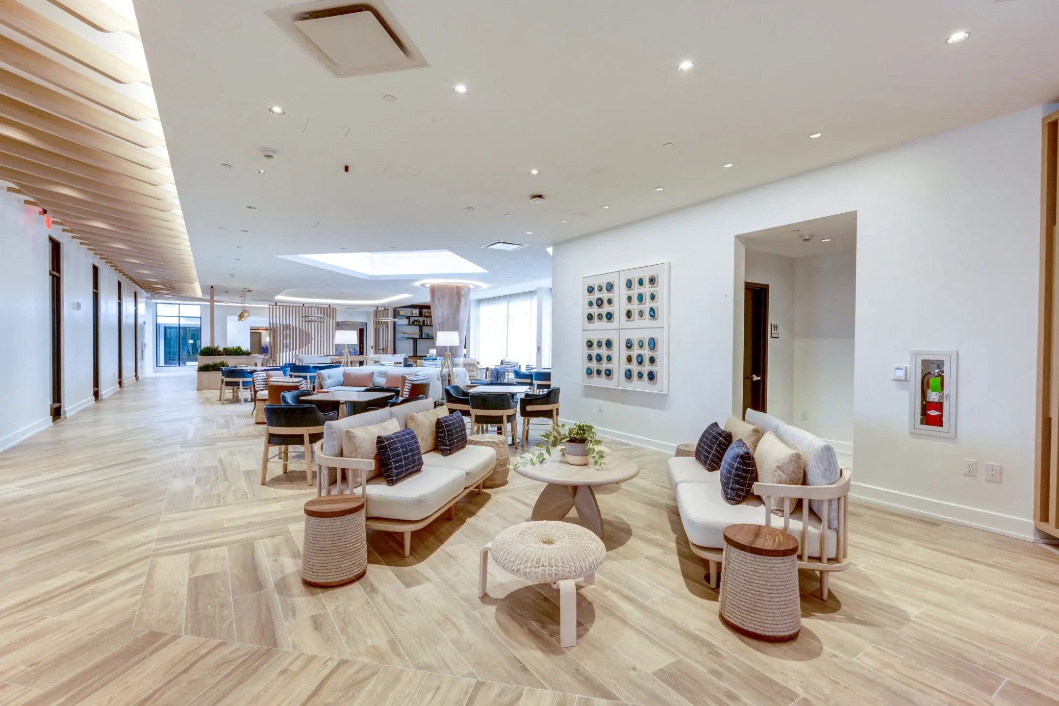 a living room with couches and tables and chairs