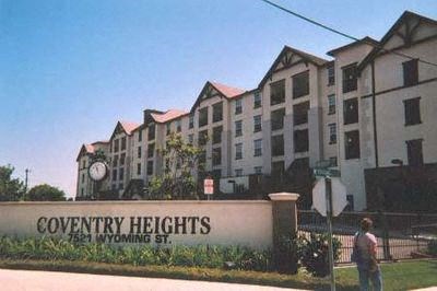 a sign for covenant heights in front of a building