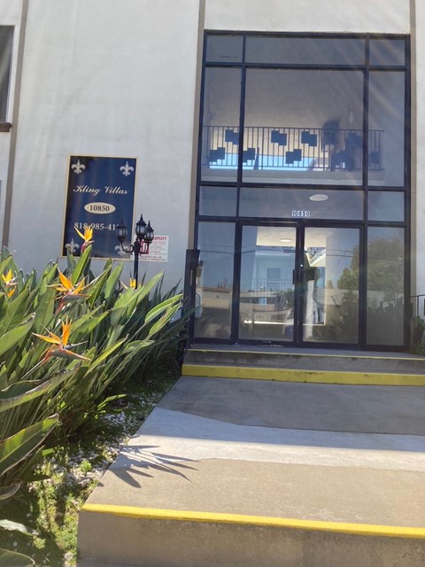 the front of a building with a glass door
