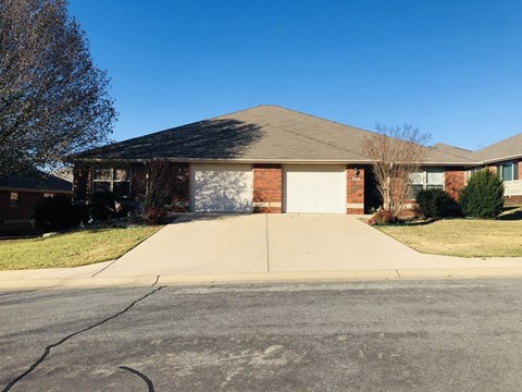 A house with a driveway in front of it.