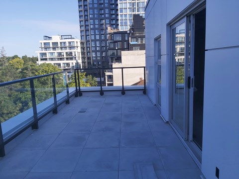 a balcony or terrace with a view of the city