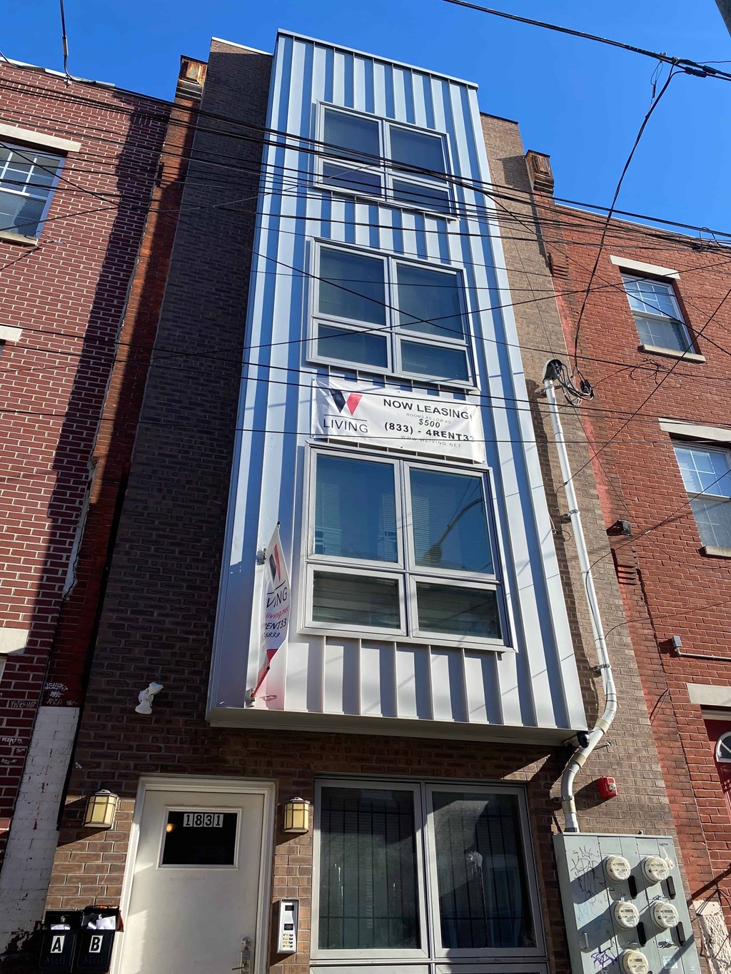 a building with a blue and white striped facade and a window