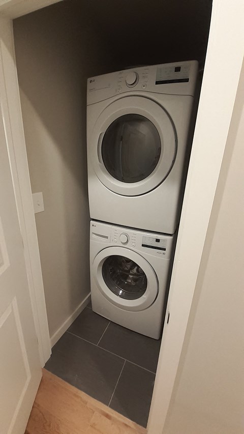 a washing machine and dryer in a small closet