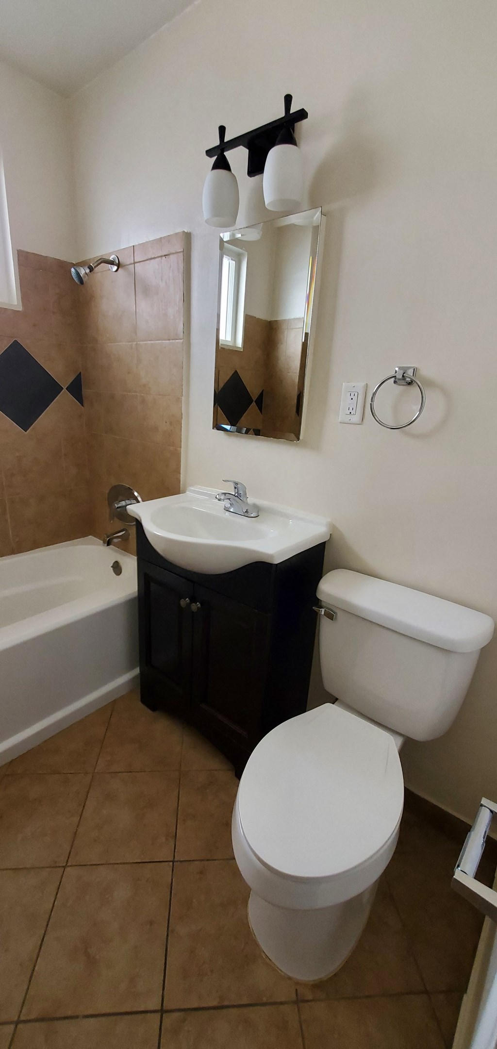 a small bathroom with a toilet sink and tub