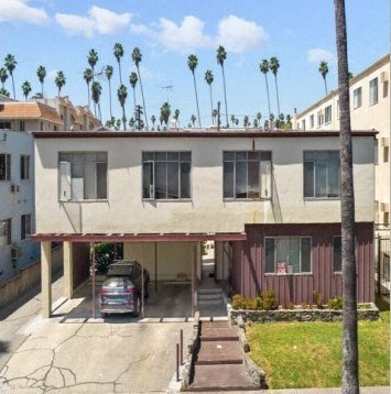 a house with a car parked in front of it