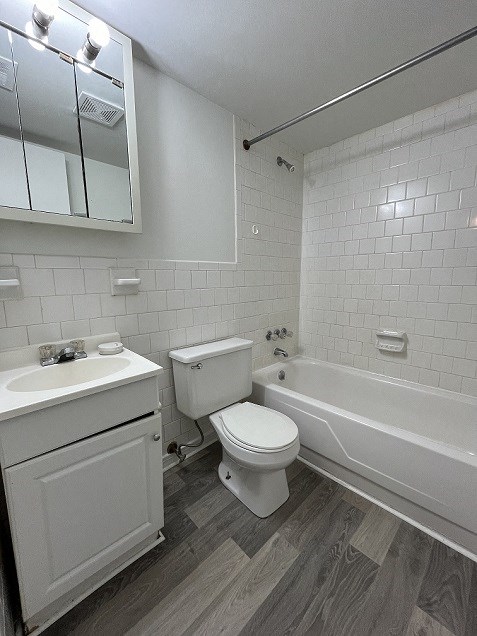 a bathroom with a toilet sink and a bath tub