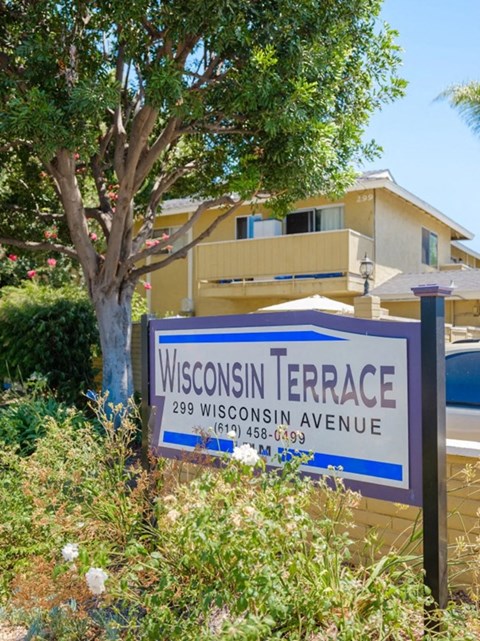 a sign in front of a building