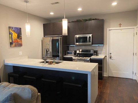 a view of a kitchen with a counter top and a sink