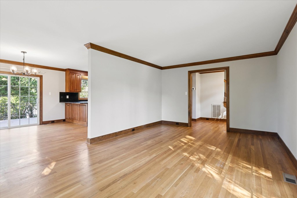 A room with wooden floors and white walls.