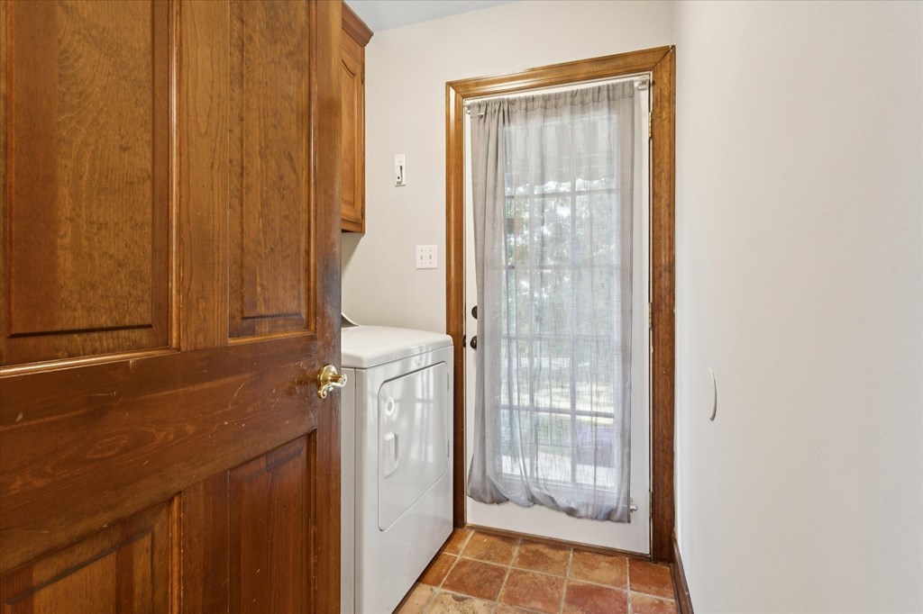 A small room with a washer and dryer in it.