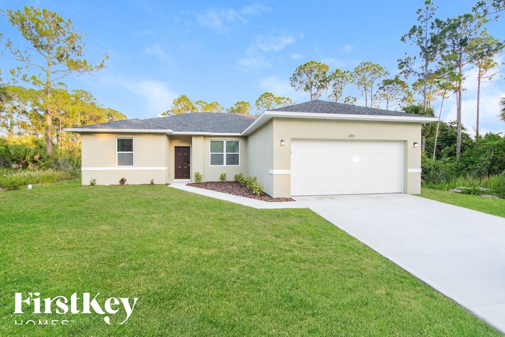 A house with a garage is for sale by FirstKey Homes.