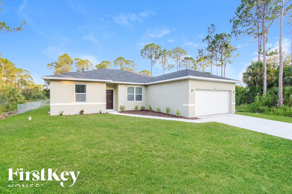A house with a garage is for sale by FirstKey Homes.