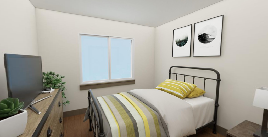 a bedroom with a bed and a tv