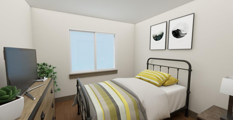 a bedroom with a bed and a tv