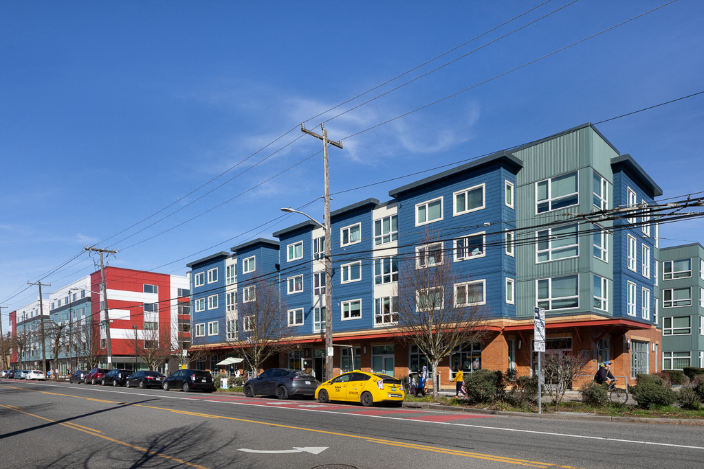 a row of colorful apartment buildings on a city street