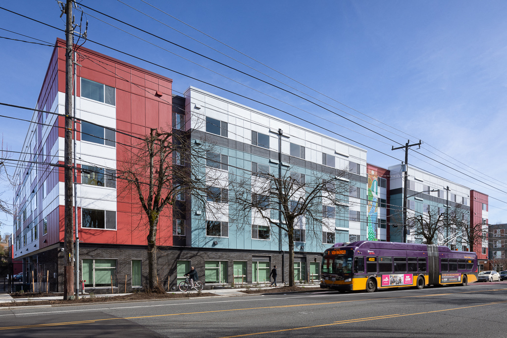 a bus parked in front of a building on a city street