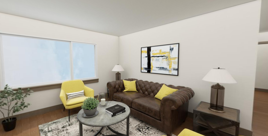 a living room with a brown couch and yellow chairs