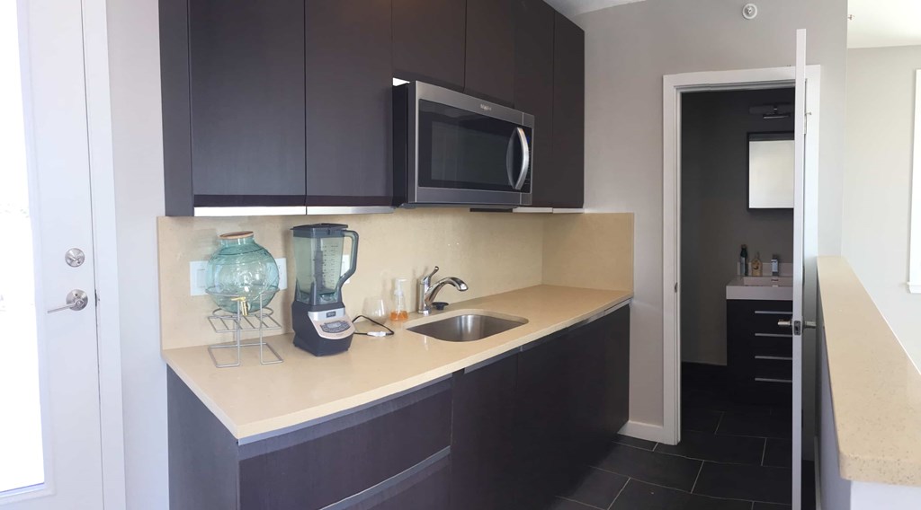 a kitchen with a sink and a microwave