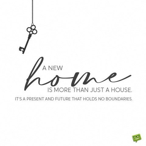 A key hanging with a quote about a new home.