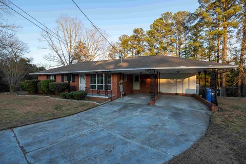 A house with a driveway in front of it.