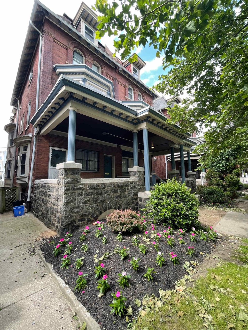 a house with a flower garden in front of it