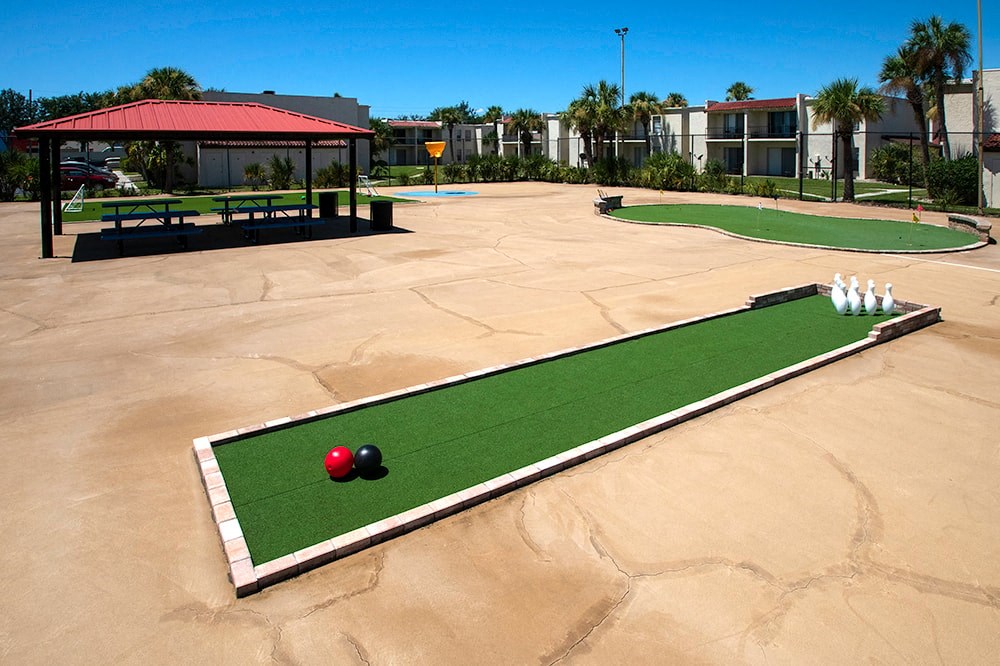 a set of mini golf courses with a red ball in the middle of a red