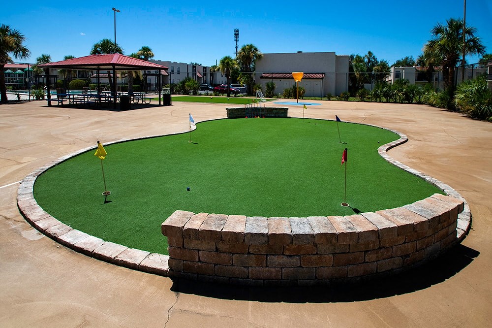 a putting green in the middle of a parking lot