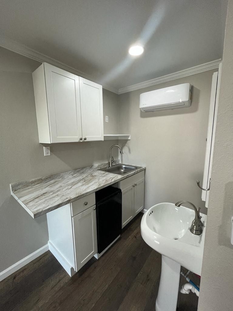 a small bathroom with a sink and a counter top