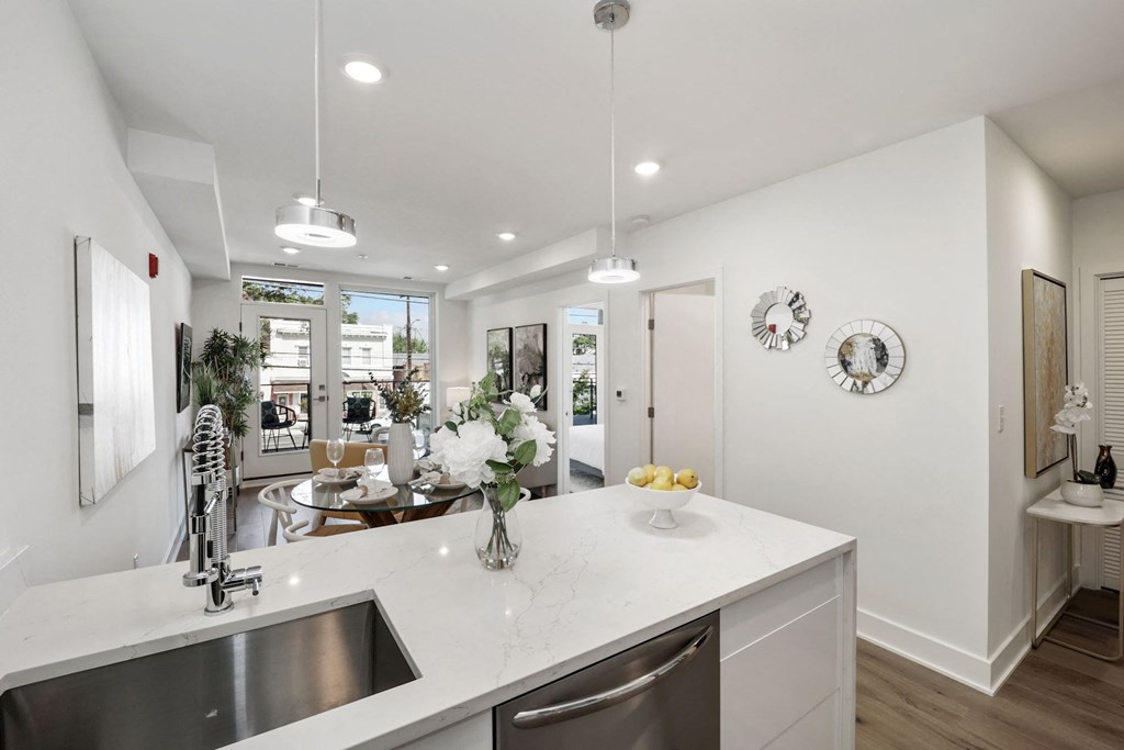 a kitchen with a large counter top and a sink