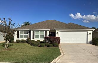 a house with a driveway and a garage door