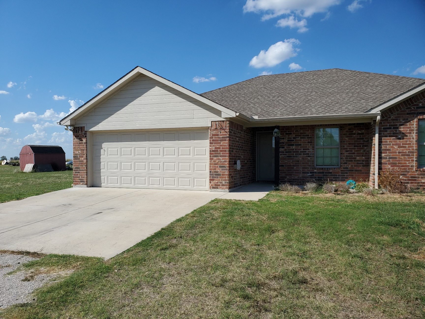 a house with a driveway and a garage door