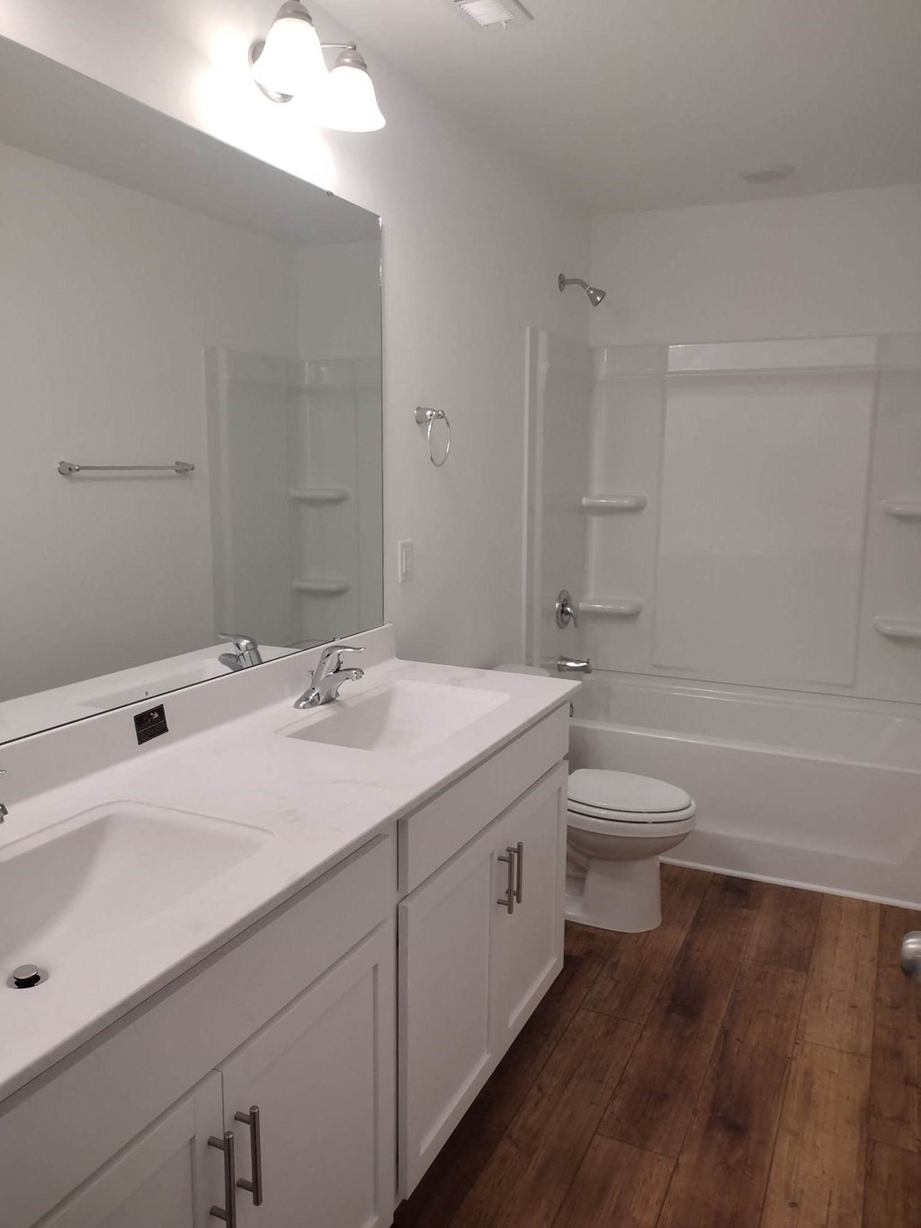 a bathroom with a sink and a toilet and a mirror