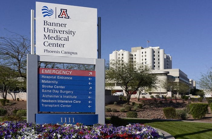 a sign for the banner university medical center in front of a hospital