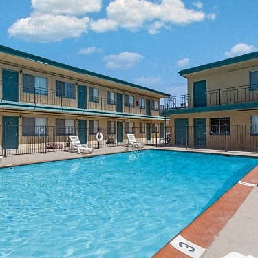 a large swimming pool in the middle of two buildings